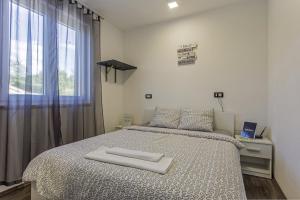 Posteľ alebo postele v izbe v ubytovaní Villa Mate in Kuhari - Haus für 8 Personen + 20 fotografií