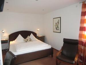 Postel nebo postele na pokoji v ubytování Hotel Zrenners GARNI