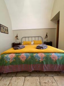 A bed or beds in a room at Masseria I Raffi b&b