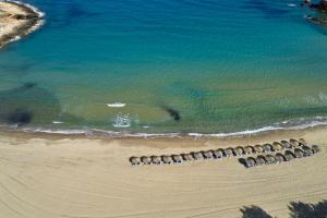 an overhead view of a beach with a group of rocks at Yria Island Boutique Hotel & Spa in Parasporos
