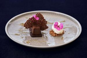 two desserts on a plate on a table at Yria Island Boutique Hotel & Spa in Parasporos