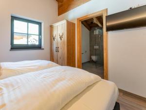 Posteľ alebo postele v izbe v ubytovaní Pinzgau Lodge 1B