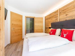 Posteľ alebo postele v izbe v ubytovaní Pinzgau Lodge 1B