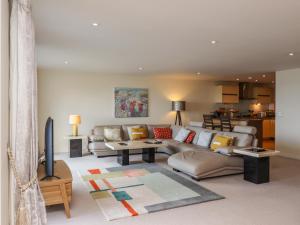 a living room with a couch and a table at Ocean View in Carbis Bay