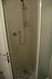 a shower with a glass door with a shower at Hotel 4 Strade in Ortona