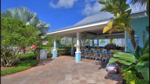 a patio with chairs under a pavilion at Holiday Inn Express & Suites S Lake Buena Vista by IHG in Kissimmee
