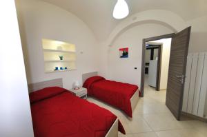 Posteľ alebo postele v izbe v ubytovaní Apartments Casa Vacanze Dante
