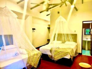 Postel nebo postele na pokoji v ubytování Hotel Minca - La Casona