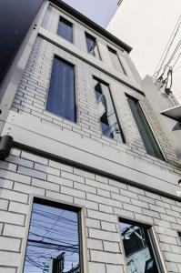 a building with windows on the side of it at Moriyama Hotel in Mandaue City