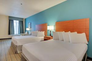 Letto o letti in una camera di Best Western Liberty Inn DuPont JBLM