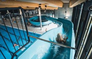 an overhead view of a swimming pool in a building at Tangen - cabin with 4 bedrooms - great nature in Norheimsund