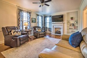 a living room with a couch and chairs and a fireplace at Little Rock Home about 5 Mi to Downtown! in Little Rock