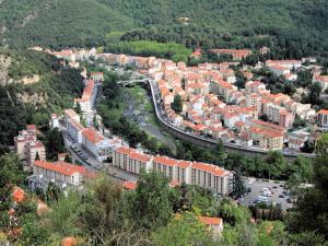 an aerial view of a city with buildings and a road at Appartement F2 avec balcon et parking à Amélie-les-Bains, idéal pour 4 personnes - FR-1-703-78 in Amélie-les-Bains-Palalda +2 photos
