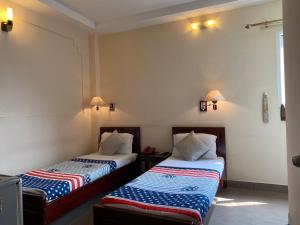 Voodi või voodid majutusasutuse Kim Hotel toas