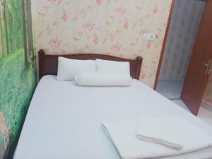 Postel nebo postele na pokoji v ubytování MOTEL MINH ANH