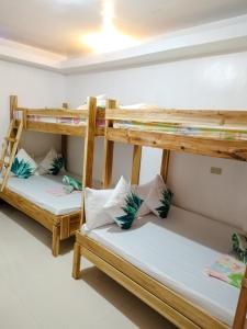 Postel nebo postele na pokoji v ubytování Joyful Guest House + 37 fotografií