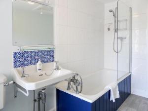 a bathroom with a tub and a sink and a shower at Craigellie in Alyth