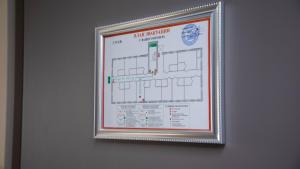 a framed picture of a map on a wall at Zodiac in Atyraū