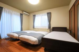 Letto o letti in una camera di 24 ORIYA Mt Fuji -鳴沢 NARUSAWA-