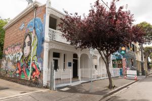 a building with a mural on the side of it at 50 Green St Windsor in Melbourne
