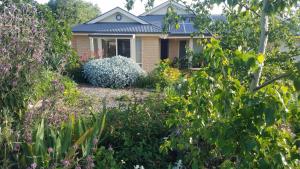 a house with a garden in front of it at Blue Wren Retreat in Orange