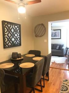 a room with a table and chairs and a living room at 15 min Ohare/Rivers Casino/Downtown & Parking2 in Chicago