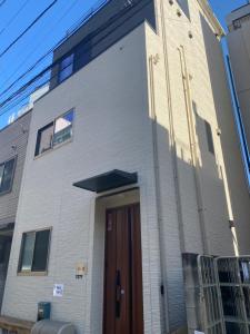 a building with a door on the side of it at 和縁WAEN in Tokyo