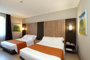 Postel nebo postele na pokoji v ubytování THotel Lamezia