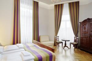 Posteľ alebo postele v izbe v ubytovaní BoutiqueHOTEL Donauwalzer