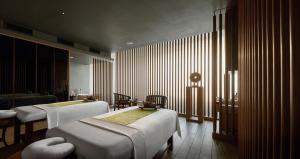 PARKROYAL Langkawi Resort客房内的一张或多张床位