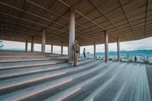 a person standing on the top of a building at Sheraton Grand Hiroshima Hotel in Hiroshima
