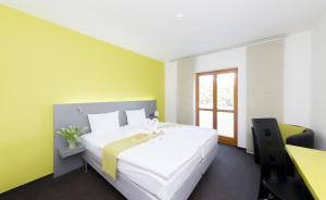 Posteľ alebo postele v izbe v ubytovaní Hotel Herrmes
