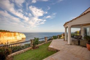 a house with a view of the ocean at Villa Tocana in Benagil