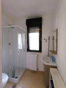 a bathroom with a shower and a sink at Villetta Marianna in Bari Palese