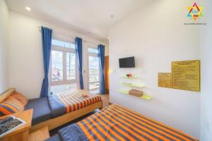 Ένα ή περισσότερα κρεβάτια σε δωμάτιο στο Villa Tuan Vu Da Lat