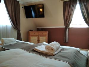 Postel nebo postele na pokoji v ubytování Mözsi Apartman Tolna