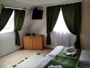 Postel nebo postele na pokoji v ubytování Mözsi Apartman Tolna
