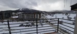 a view of a ski resort in the snow at Nino's Sunny Apartment in Bakuriani