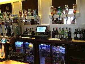 a bar with a lot of bottles on it at The Wight Bay Hotel in Sandown