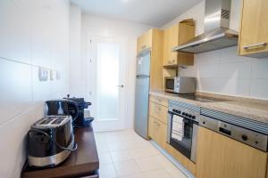 Kuchyň nebo kuchyňský kout v ubytování Los Robles de Los Arqueros golf 3 bedrooms apartment.