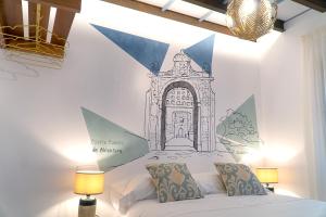 A bed or beds in a room at Cervantes 5 Collection Catedral - Alcántara