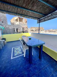 a table and a chair in a room at Holiday Home Case Blu in Lipari +56 photos
