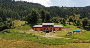 an aerial view of a house on a hill at Agriturismo Baita Bavè in Pellio Inferiore