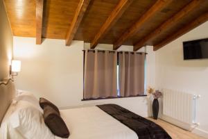 Cama o camas de una habitación en Osabarena Hotela