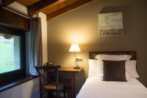 Cama o camas de una habitación en Osabarena Hotela