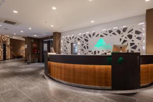 a lobby of a hotel with a reception desk at Hotel Montarto in Baqueira-Beret