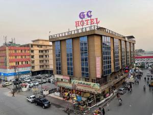 a hotel with a sign on top of a building at Grace Crown Hotel in Rawalpindi