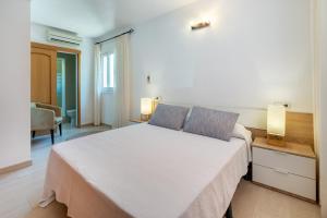 A bed or beds in a room at Villa Cas Puig - Beach of Portinatx