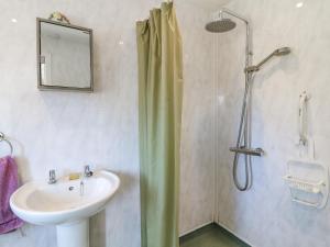a bathroom with a sink and a shower at Bear Lake Lodge in Alderwasley +12 photos