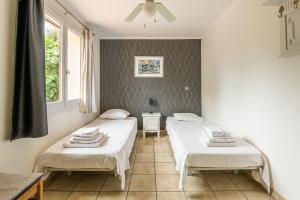 Łóżko lub łóżka w pokoju w obiekcie Villa Cosy